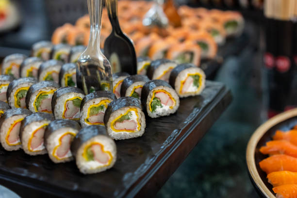 Variety of sushi on the trays in the buffet