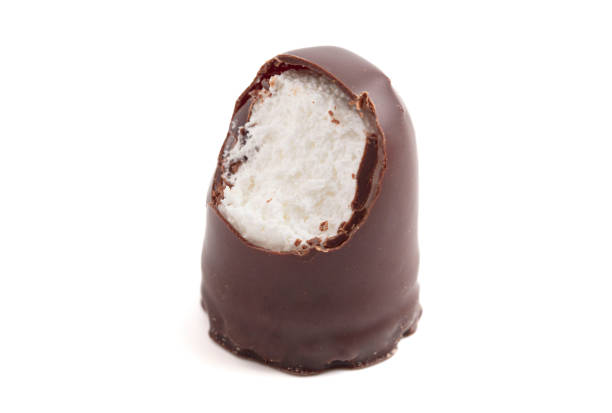Dark Chocolate Covered Marhsmallows with a Waffer Base Known as Chocolate Kisses or Schokokuss on a White Background