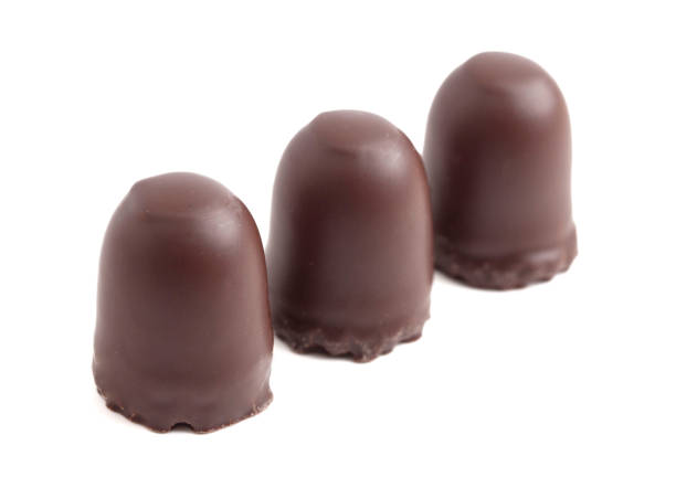 istock Dark Chocolate Covered Marhsmallows with a Waffer Base Known as Chocolate Kisses or Schokokuss on a White Background 2099976798