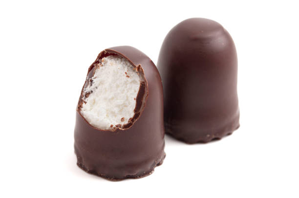 istock Dark Chocolate Covered Marhsmallows with a Waffer Base Known as Chocolate Kisses or Schokokuss on a White Background 2099976802