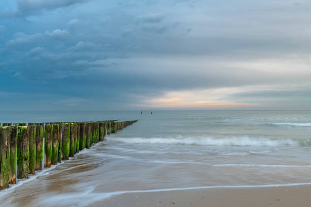Beach near Domburg town in spring fresh morning with cloudy color sky