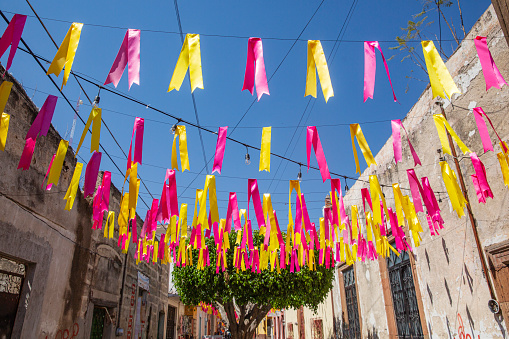 Colourful ribbons strung across a small street in the town of Salvatierra in the state of Guanajuato.