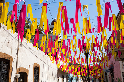 Colourful ribbons strung across a small street in the town of Salvatierra in the state of Guanajuato.