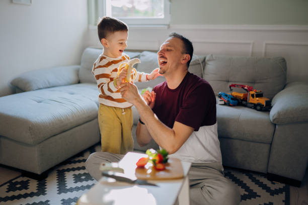 istock Eating fruits while sitting on the floor 2100030323