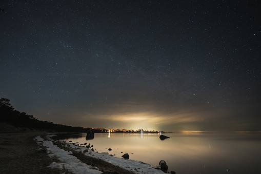 Landscape astrophoto on the shore of the Baltic Sea in Kaberneeme on the beach. High quality photo
