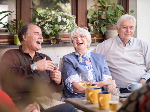 istock Seniors enjoying outdoor drinks party 2100067813