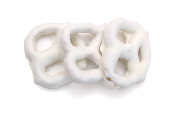 istock white chocolate covered pretzels on white background 2100073087