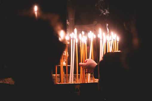 Greek Orthodox Christian Easter ceremony procession, divine worship service, worshippers hold candles, parishioners during an Easter vigil mass in a Cathedral, Athens, Attica, Greece, divine liturgy