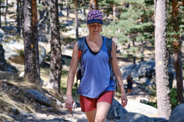 istock Woman with backpack enjoying the outdoors 2100110118