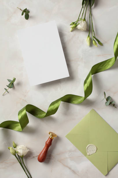 istock Wedding stationery, invitation mockup, and flowers on marble background. Flat lay, top view, copy space 2100240768