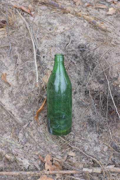 istock garbage from one dirty old glass green bottle 2100241285