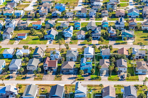 Homes built on stilts in a beachfront subdivision located on Galveston Island, Texas along the Gulf of Mexico shot via helicopter from an altitude of about 600 feet.