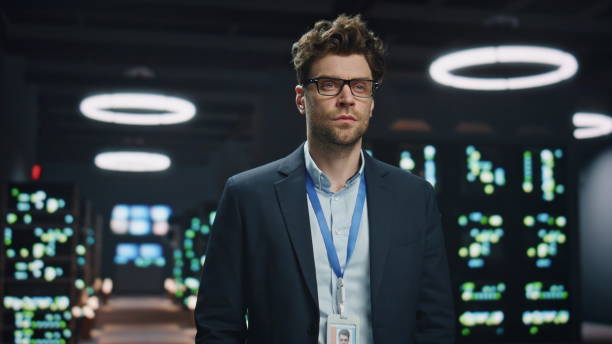 istock Digital entrepreneur posing neon lights datacenter closeup. Man looking camera 2100256876