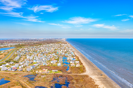 Homes built on stilts in a beachfront subdivision located on Galveston Island, Texas along the Gulf of Mexico shot via helicopter from an altitude of about 600 feet.