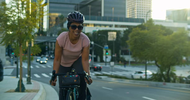 istock African American Cyclist Riding up Steep Road 2100312085