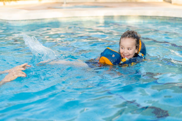 istock A child is in the water with a life jacket on 2100383805