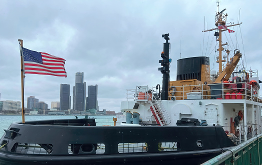 A Coast Guard ship is shown moored in Windsor, Ontario and overlooking Detroit, Michigan.