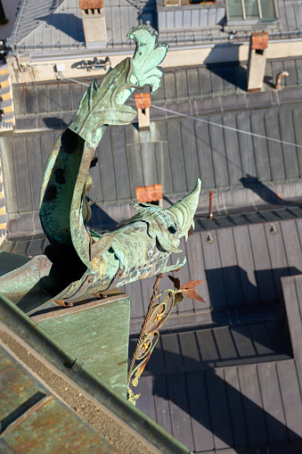 One of the gargoyles on the city tower of Innsbruck, Austria. Europe.