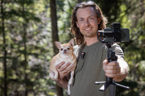 istock Filming a video with my dog 2100485459