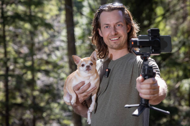 istock Filming a video with my dog 2100486538