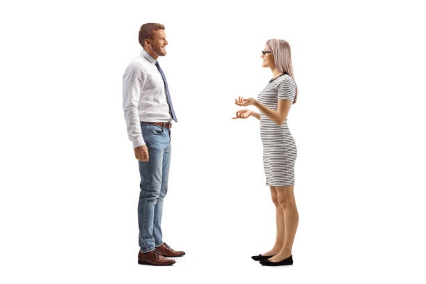 istock Man and woman standing and discussing something 2100499339