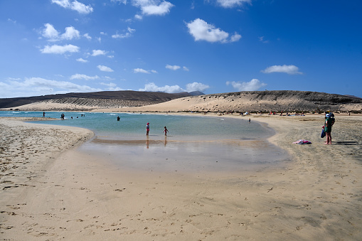 Pájara, Fuerteventura, Spain, February 20, 2024 - Beach life at Playa de la Barca and Playa de Sotavento de Jandia, Fuerteventura, Canary Islands, Spain.