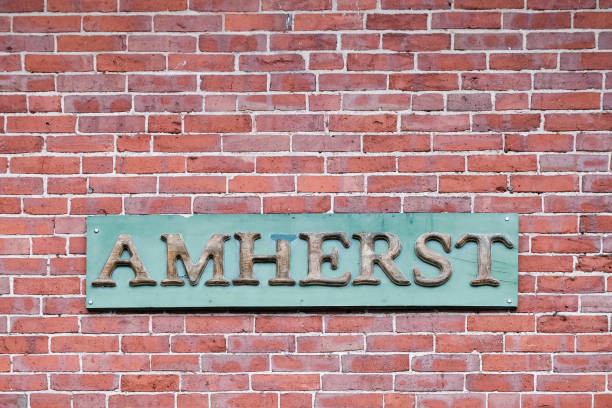Amherst Sign Old Amherst Sign on a brick wall university of massachusetts amherst stock pictures, royalty-free photos & images