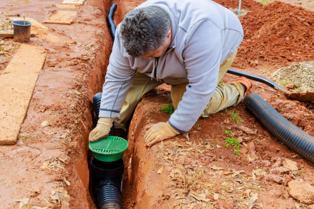 istock Laying underground drainage pipe system for outflow of rain a stormwater 2100568444