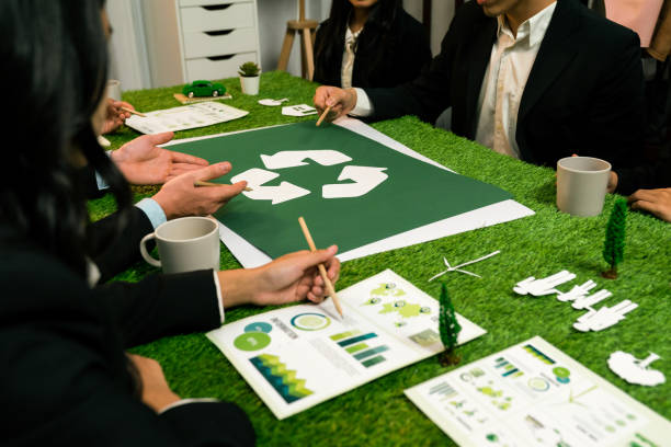 istock Recycle icon on meeting table with business people. Quaint 2100571536