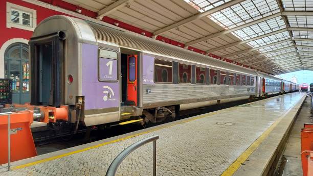 Santa Apolonia Train Station, passenger train in the platform hall with glass canopy, Lisbon, Portugal stock photo