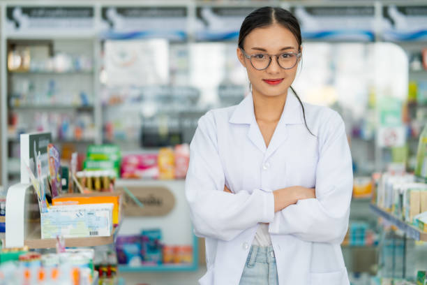 istock Confident Pharmacist Standing in Drugstore 2100668537