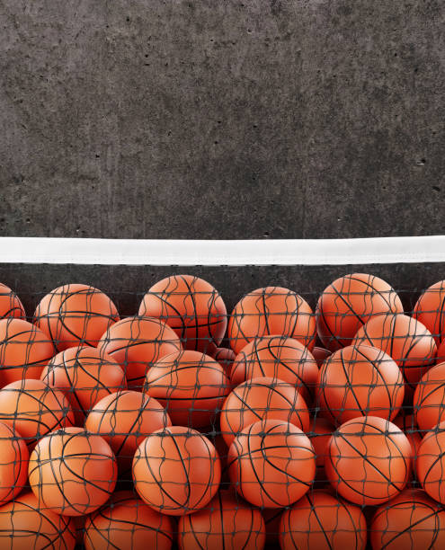 istock Several basketball balls in the net. Cement background. 2100701453
