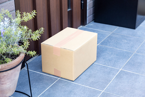 A cardboard box placed at the entrance.