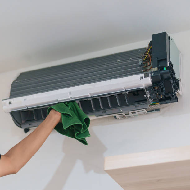istock Man technician maintenance air conditioner. Purification system for cleaning dust PM2.5 and virus in home. Repair, Washing, Conditioning Service, Allergy, Pure air, health, Wellness and Air Pollution 2100733544