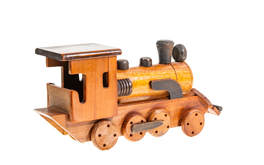 Old wooden toy train isolated on white