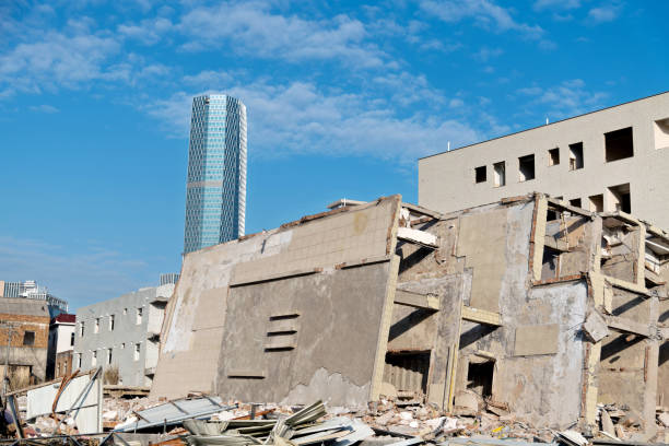 Contrast of demolished old house and modern office building.
