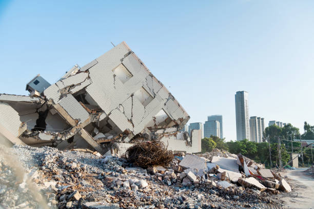 istock Contrast of demolished old house and modern skyscraper 2100771687