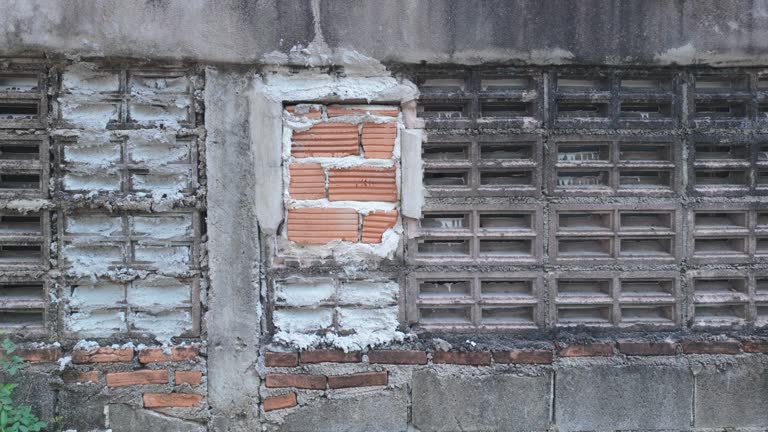 Concrete Fence and Weathered Wall with Bricks and Plaster