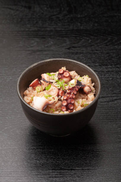 istock Japanese octopus rice cooked in a bowl 2100814435