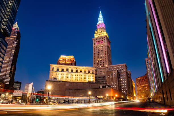 This is a long exposure of the Terminal Tower at twilight with cars driving by in downtown Cleveland, Ohio.