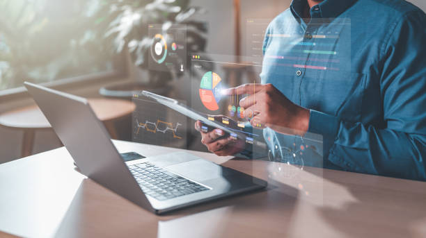 istock use tablet to planning your project. then plan progress HUD, boost productivity to management. 2100818445