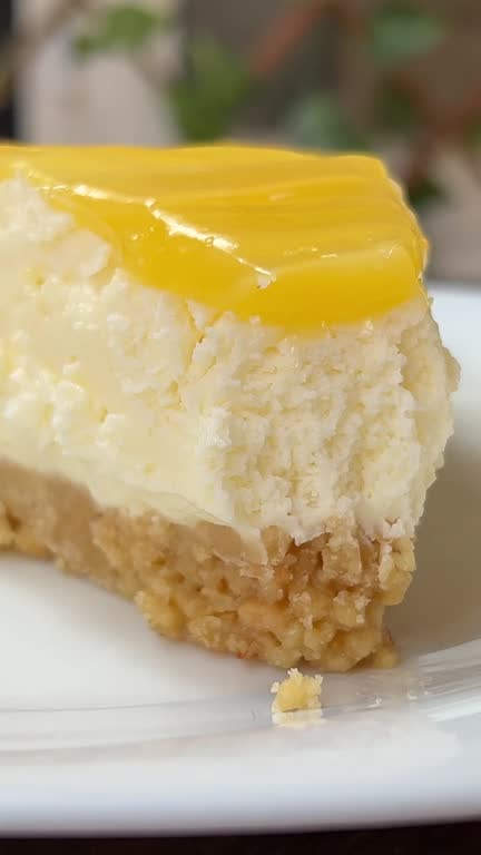 Footage of a fork scooping delectable sweet and tart lemon cream cheese pie