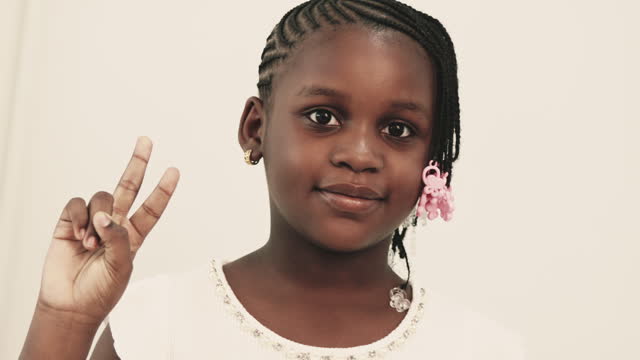African girl held up two fingers