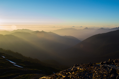 Sunset sunbeams shining in the valleys of the North Cascades