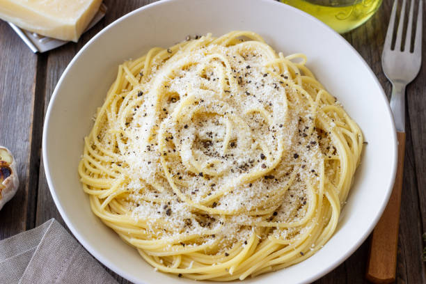 istock Roman pasta spaghetti with black pepper and cheese. Cacio e pepe. Recipes. 2100904974