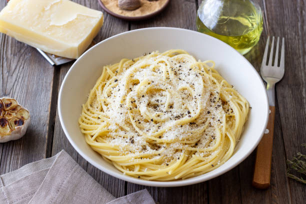istock Roman pasta spaghetti with black pepper and cheese. Cacio e pepe. Recipes. 2100904983