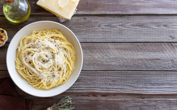 istock Roman pasta spaghetti with black pepper and cheese. Cacio e pepe. Recipes. 2100905496