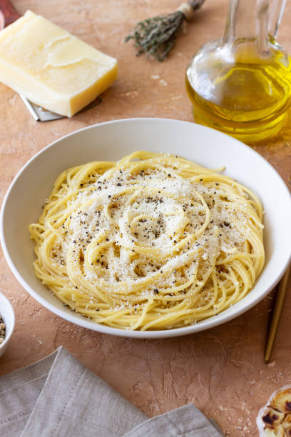 istock Roman pasta spaghetti with black pepper and cheese. Cacio e pepe. Recipes. 2100906649