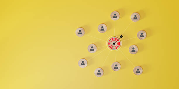 istock Conceptual target and network illustration with icons on a vivid yellow background. 2100907222