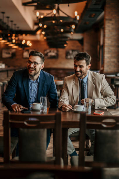 istock Business professionals gather in a relaxed setting 2100940338